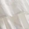 Top cami din bumbac cu tiv în formă de batistă
