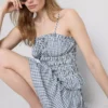 Top cu bretele subțiri, peplum și imprimeu gingham plisat