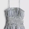 Top cu bretele subțiri, peplum și imprimeu gingham plisat