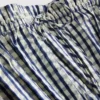 Top cu bretele subțiri, peplum și imprimeu gingham plisat