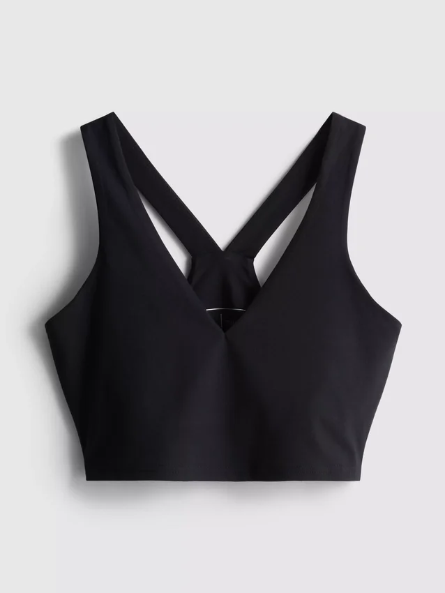 Top scurt sport cu decolteu în V, care oferă susținere Top scurt sport cu decolteu în V, care oferă susținere