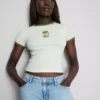 Tricou pentru bebeluși din bumbac cu imprimeu și guler tip „ringer”