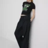 Tricou pentru bebeluși din bumbac, de culoare verde, cu volane Tricou pentru bebeluși din bumbac, de culoare verde, cu volane