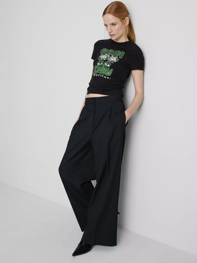 Tricou pentru bebeluși din bumbac, de culoare verde, cu volane Tricou pentru bebeluși din bumbac, de culoare verde, cu volane